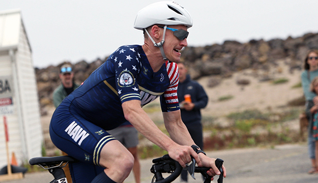 Navy Lt. Cmdr. Kyle Hooker of the Pentagon rides to his seventh gold medal during the 2024 Armed Forces Triathlon Championships was held at Naval Base Ventura County, Calif., June 26-30. Service members from Army, Marine Corps, Navy (with Coast Guard) and Air Force (with Space Force) battled alongside the Canadian forces for gold. (U.S. Army photo by Master Sgt. Sharilyn Wells/USACAPOC(A) PAO)